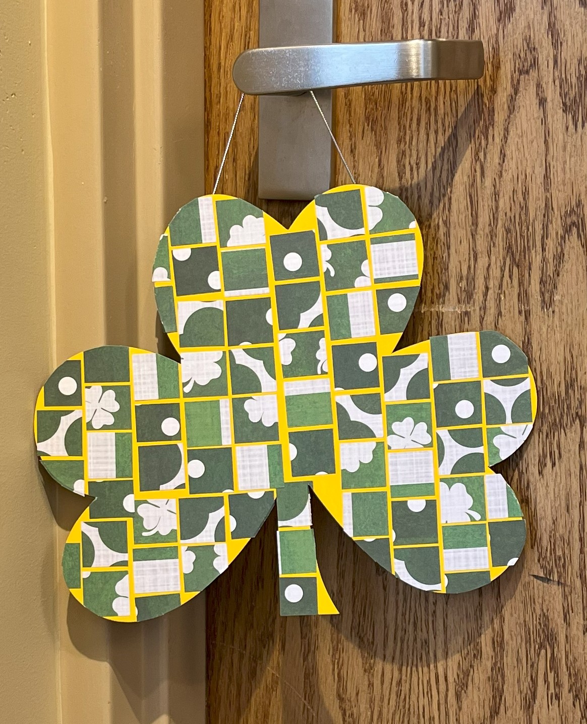 Wooden shamrock decorated with scrapbook paper squares