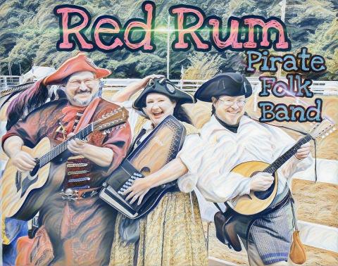 Three members of Red Rum Pirate Folk band with their instruments.