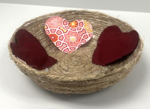 Jute rope bowl with three heart sachets.