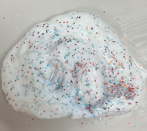 White slime with red and blue glitter