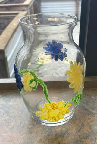 Vase with flowers painted on it