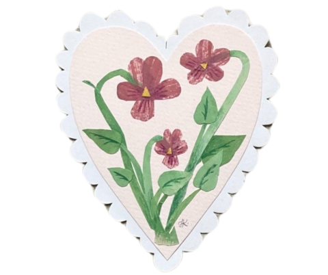 Paper heart decorated with a flower image.