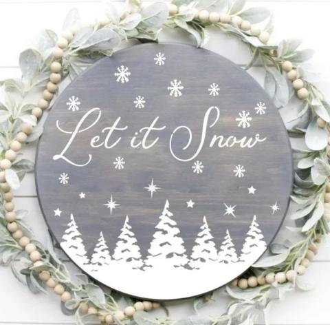 12-inch wood door hanger sign that says Let it Snow with snowflakes and trees.
