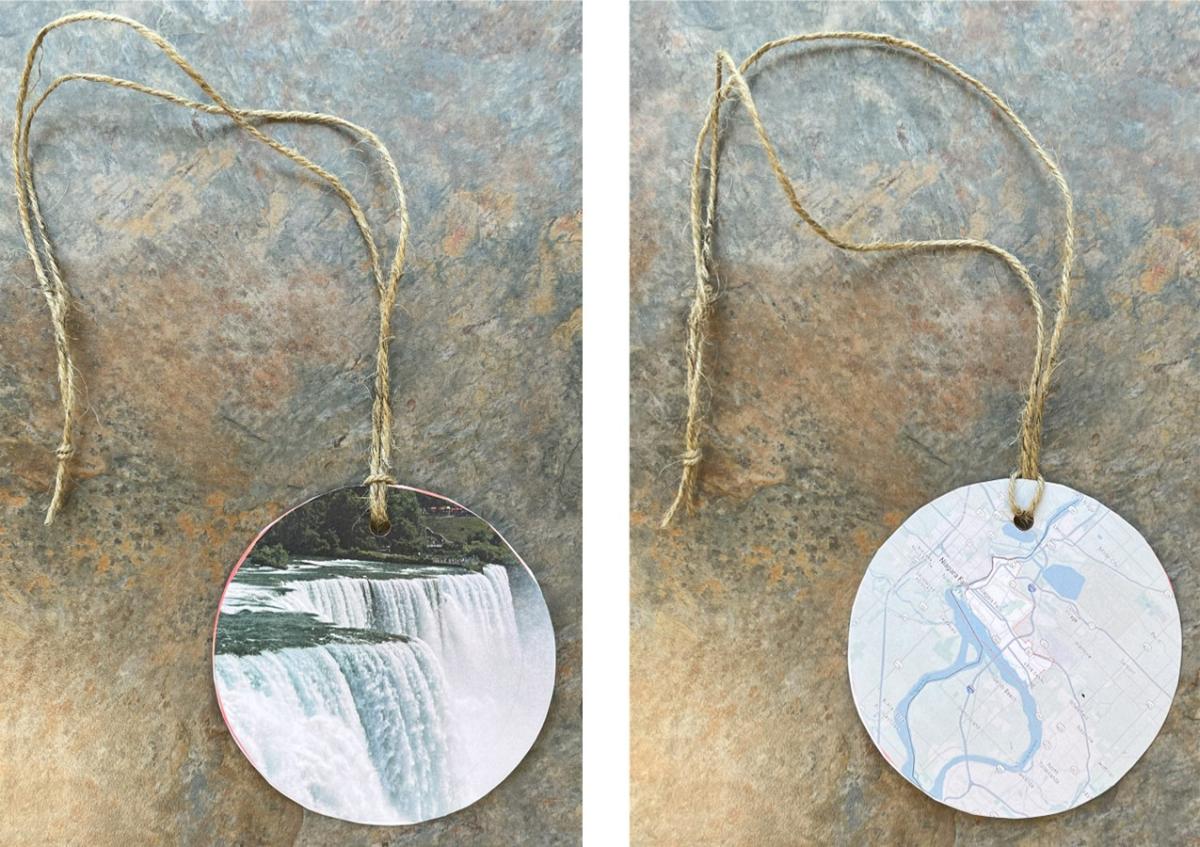 Necklaces with an image on one side and a map on the other