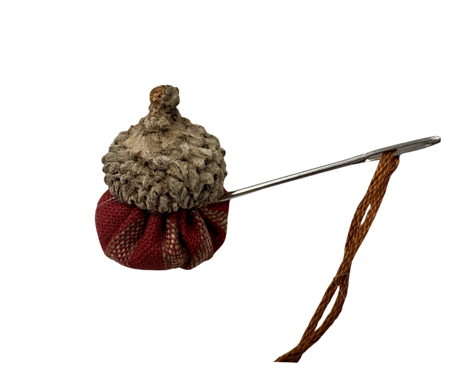 Acorn pincushion with needle and thread